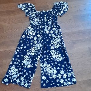 A Jumpsuit with capris pants